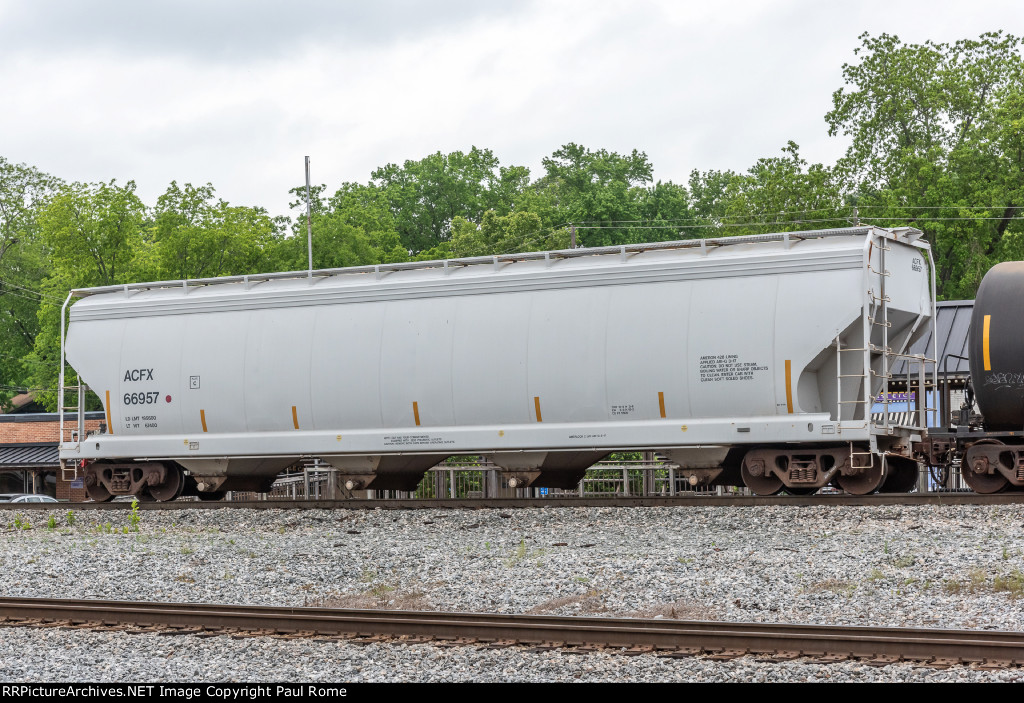 ACFX 66957, 4-bay Center-Flow Covered Hopper westbound on the NSRR at Norris Yard